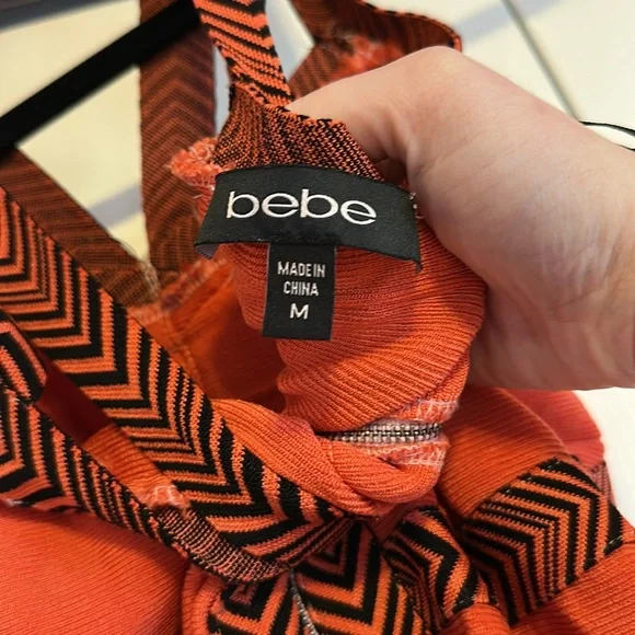 59 BEBE | Orange And Black Bandage Dress - Picture 3 of 3